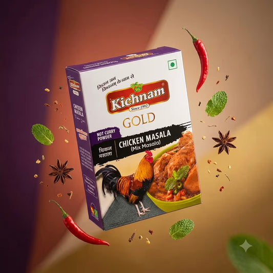 A box of Kichnam Gold Chicken Masala (Mix Masala) hot curry powder is shown floating at an angle against a warm brown and gold gradient background with floating decorative ingredients like red chili peppers, mint leaves, and star anise.