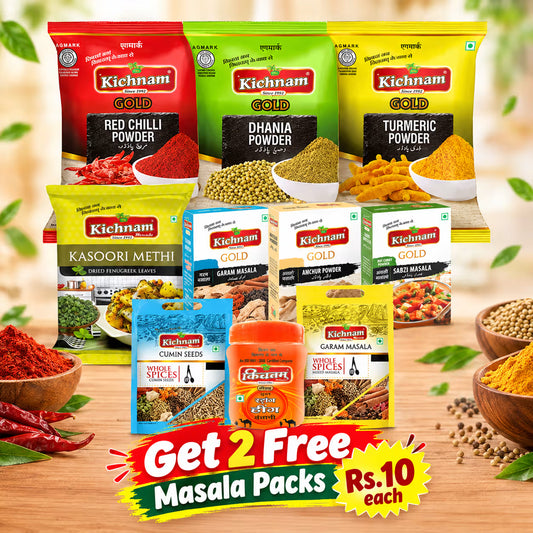 A promotional product collage for Kichnam Gold masala spice mix. Multiple spice powder and whole spice product packages are arranged together on a wooden surface with bowls of colorful spices and chilies around them.