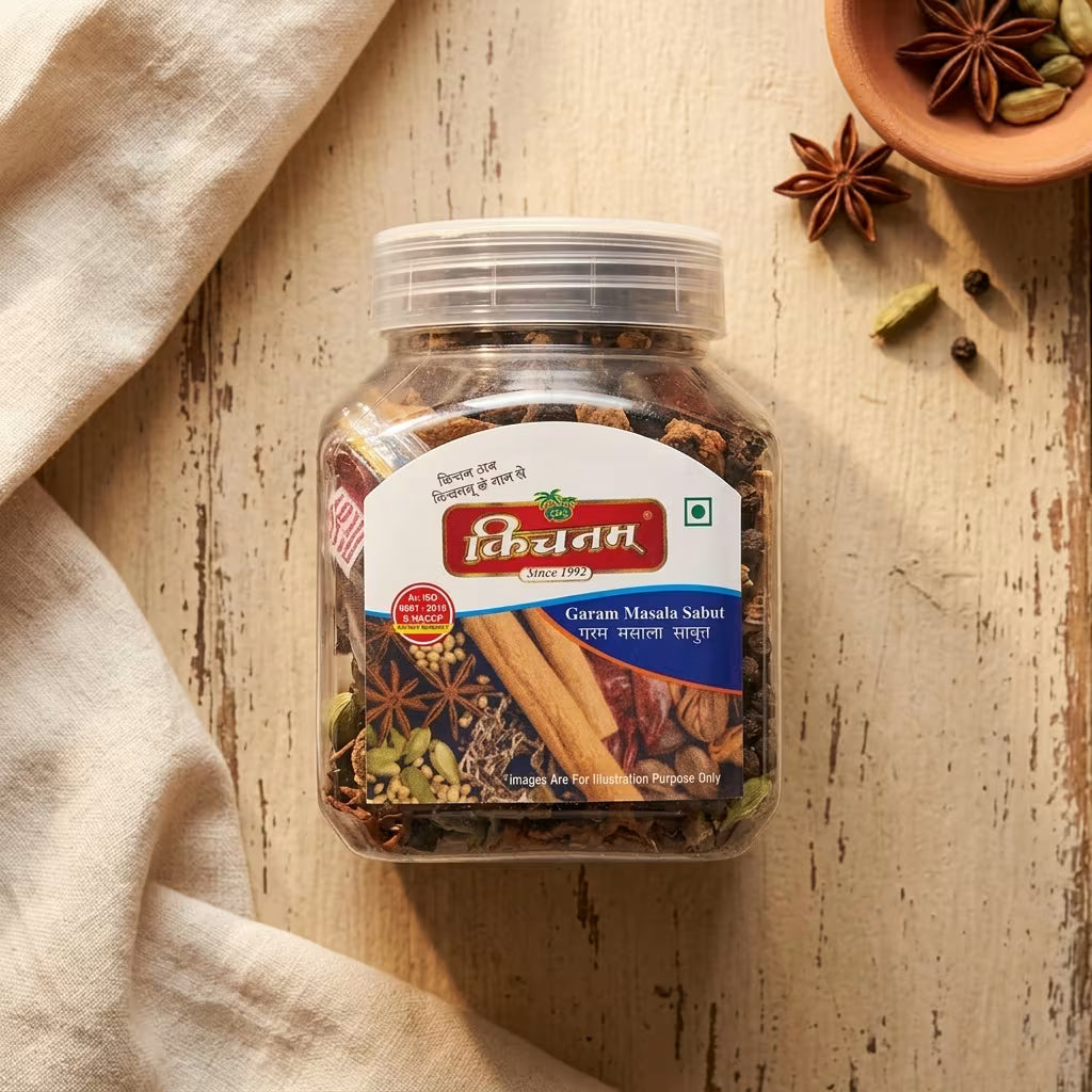 Jar of spices with a kichnam brand label on a wooden surface