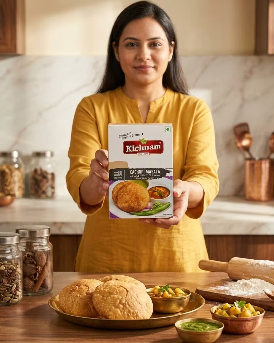 Woman holding a Kichnam product in a kitchen setting with food items on the table.