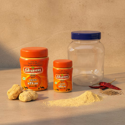 best hing in india Two orange jars with spices and a clear jar on a beige background