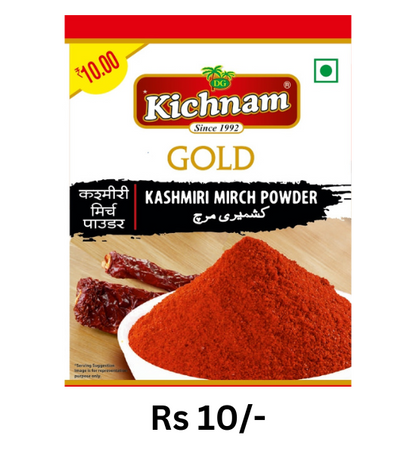 Kichnam Gold Kashmiri Mirch Powder red chili spice pouch priced at Rs 10 with dried red chilies background