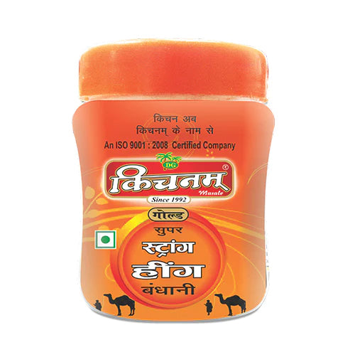 Bright orange Kichnam Hing jar featuring a yellow label and camel graphics.